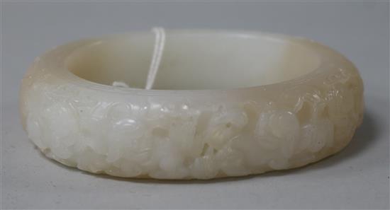 A Chinese white and russet jade bangle